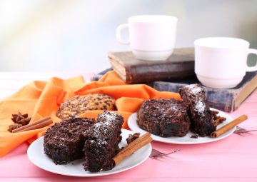 delicious-chocolate-roll-wooden-table-with-orange-napkin-books-closeup (1)